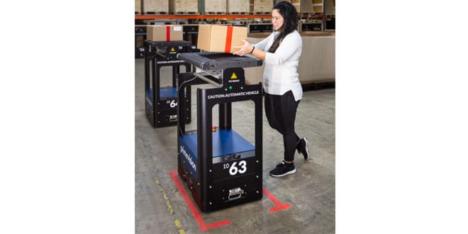 Warehouse staff and robots work hand in hand to meet demand